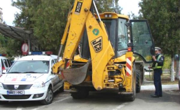 Un clujean de 47 de ani prins beat cu buldoexcavatorul
